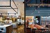 Modern home with Dining Room, Chair, Table, and Track Lighting. Saison (San Francisco, California)
An open layout creates complete transparency between the kitchen and dining area at Saison, designed by Samantha+Hart Architecture, Michael Gibson of Tenant Design, and Jiun Ho. The restaurant's cozy capacity—18 seats—prevents the space from feeling too exposed, however. For the kitchen, the owners imported a custom Molteni stove from Italy, the only one in San Francisco. Photo of The 10 Best-Designed Restaurants in America