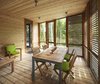 Walls and ceilings fold like origami, sheltering the interior with tent-like flaps. On the enclosed porch, horizontal slats, a modern hallmark often seen in the pages of Dwell, is palatable for a traditionalist thanks to generous use of cedar. Photo by Shai Gil. Photo 7 of Stealth Cabin modern home