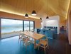 Modern home with Kitchen, Colorful Cabinet, Ceramic Tile Floor, Pendant Lighting, and Undermount Sink. Hans Wegner Wishbone chairs surround a custom table by Mary Arnold-Forster. The pendant lamps are by Bestlite. Photo of 17 Modern Homes With Hans Wegner Furniture