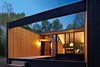 Modern home with Exterior, House Building Type, Wood Siding Material, Prefab Building Type, and Flat RoofLine. A corrugated metal roofing, pine walls stained a warm blonde hue, and an abundance of glass make this modern prefab feel much roomier than its 1,600-square-feet size.
Photo of Superior Logic