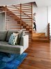 Architect Julie Fisher of Chicago-based firm fcStudio inc gut-renovated a historic house in the city. Challenged with a narrow footprint—25 feet at the house’s widest and 21 feet at its most slender—Fisher worked to create a modern interior custom fit for a family of four. In addition to designing the interior architecture, Fisher selected the furnishings. A walnut staircase wends its way from floor to floor and creates sculptural moments on each level. A Honeycomb rug purchased from One King’s Lane and a Bensen Edward sofa from ID Chicago outfit the living room. Photo 2 of Lakeview modern home