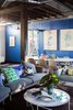 The Design Files Open House 2013 features furniture by Jardan, like the Nook sofa in the living room. Shown here are pillows by Bonnie and Neil and L.O.T.S, and a coffee table by Dinosaur Designs and The Forty Nine Studio. Mondrian Blue wall paint by is applied to the rear wall. Photo by Phu Tang. Photo of Tour Modern, Colorful Design Files Show House in Sydney modern home
