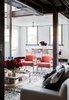 The other side of the living room opens onto a light-filled entryway. Flowers by Lisa Cooper; rug by Loom. Photo by Phu Tang. Photo of Tour Modern, Colorful Design Files Show House in Sydney modern home