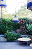 On the roof deck, a Fred outdoor table by Jardan mingles with lights by Lightly. Photo by Phu Tang.
See here for the full list of suppliers in the Design Files Open House. Photo of Tour Modern, Colorful Design Files Show House in Sydney modern home