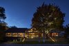 Modern home with Exterior, Glass Siding Material, House Building Type, Cabin Building Type, Wood Siding Material, and A-Frame RoofLine. The structure was originally built as a foundry in the late 19th century and became a bed and breakfast before hotelier Jeff Stober purchased the property. “We are offering visitors and locals alike a really fun and inspired experience in one of the most beautiful regions of Canada,” he says. The Owner's Suite is underneath the gable on the second floor. Guests have access to expansive outdoor decks around the building. Photo 3 of Drake Devonshire Inn