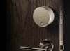 Why consider the August over competitors like Lockitron or Goji? Yves Behar, the man behind the Jawbone Jambox speaker and the Jawbone UP, designed the August. The result is something that looks like the future, but is subtle enough not to distract from a door’s wood grain. Photo of August Smart Lock is Both Functional and Attractive modern home