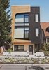 Modern home with Exterior, House, Flat RoofLine, and Metal Siding Material. Architects Tiffany Bowie and Joe Malboeuf’s Capitol Hill, Seattle, infill project was completed for $189 per square foot. Its street-facing facade is clad in prefinished siding from Taylor Metals, and cedar shaped and cut with CNC technology. The couple was inspired by the porthole windows of the Maritime Hotel in New York City, one of their favorite buildings. Photo of Architects Get Crafty With Budgets to Build Cost-Effective Modern Homes