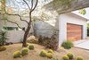 Modern home with Garage and Attached Garage. Lockyer added native desert plants to a courtyard near the garage. Photo of 47+ Midcentury Modern Homes Across America