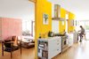 Modern home with Kitchen, White Cabinet, Range, Range Hood, and Marble Counter. How a highly productive collaboration among a trio of creative Angelenas—and a good dose of Barragán—turned a dark and beleaguered midcentury house into a family home for the ages. Photo by Lisa Romerein. Photo of Tips and Tricks for Bringing Color Into the Kitchen