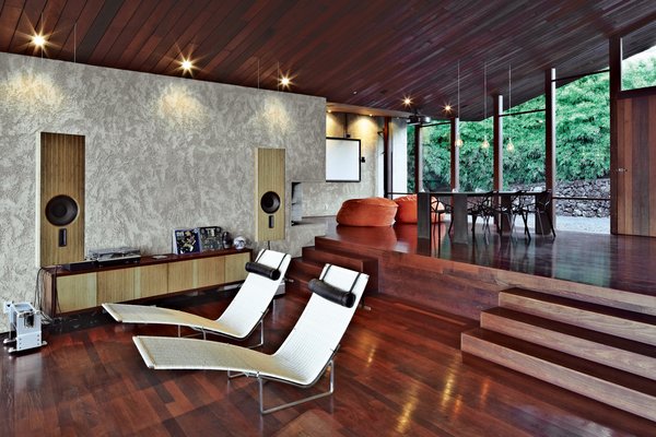 Dekleva Gregorič Arhitekti, along with resident Robert Stroj, designed most of the furnishings in the house, including the speakers, wall cabinet, and dining table. The beanbag pouffes are by Slacker Sack and the Chair-One dining chairs are by Konstantin Grcic for Magis. The stucco used on the walls was custom made from a mixture of white concrete, coral sand, dune sand, and lime.