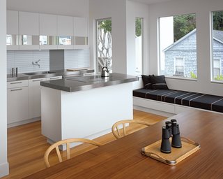 Black accent pieces create the illusion of a black and white kitchen in the home of San Francisco architect Cass Calder Smith. A black reading nook coordinates perfectly with the stainless steel countertops and white cabinetry.