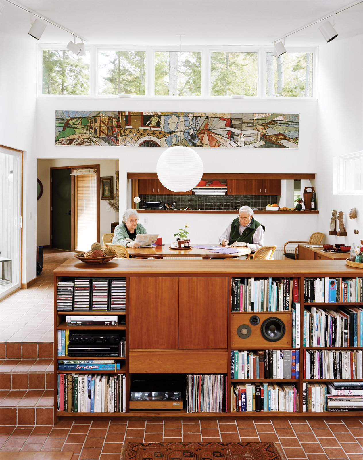 Cohen and his wife, Sally, sit in the dining room, which along with the connected living room, is a focal point of the house, lighted in part by high, remote-controlled clerestory windows.