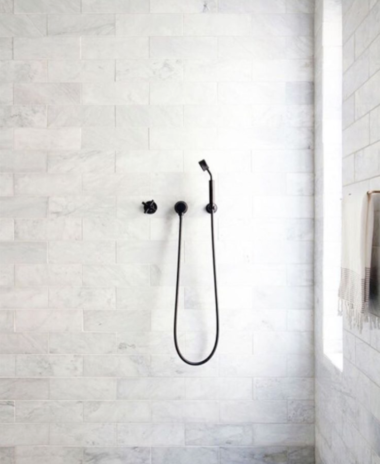 @emilylauren.au posted this pared-down bathroom with monochromatic matte fixtures by Chanee Vijay.