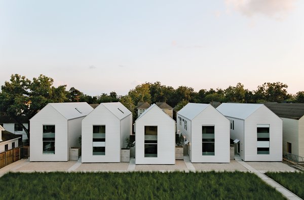 The series of pitched white buildings was inspired by the work of architect Hugh Newell Jacobsen. 
