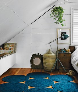 The walls and ceiling would originally have been covered in plaster, but are instead just covered in paint to reveal the texture of the wood underneath.