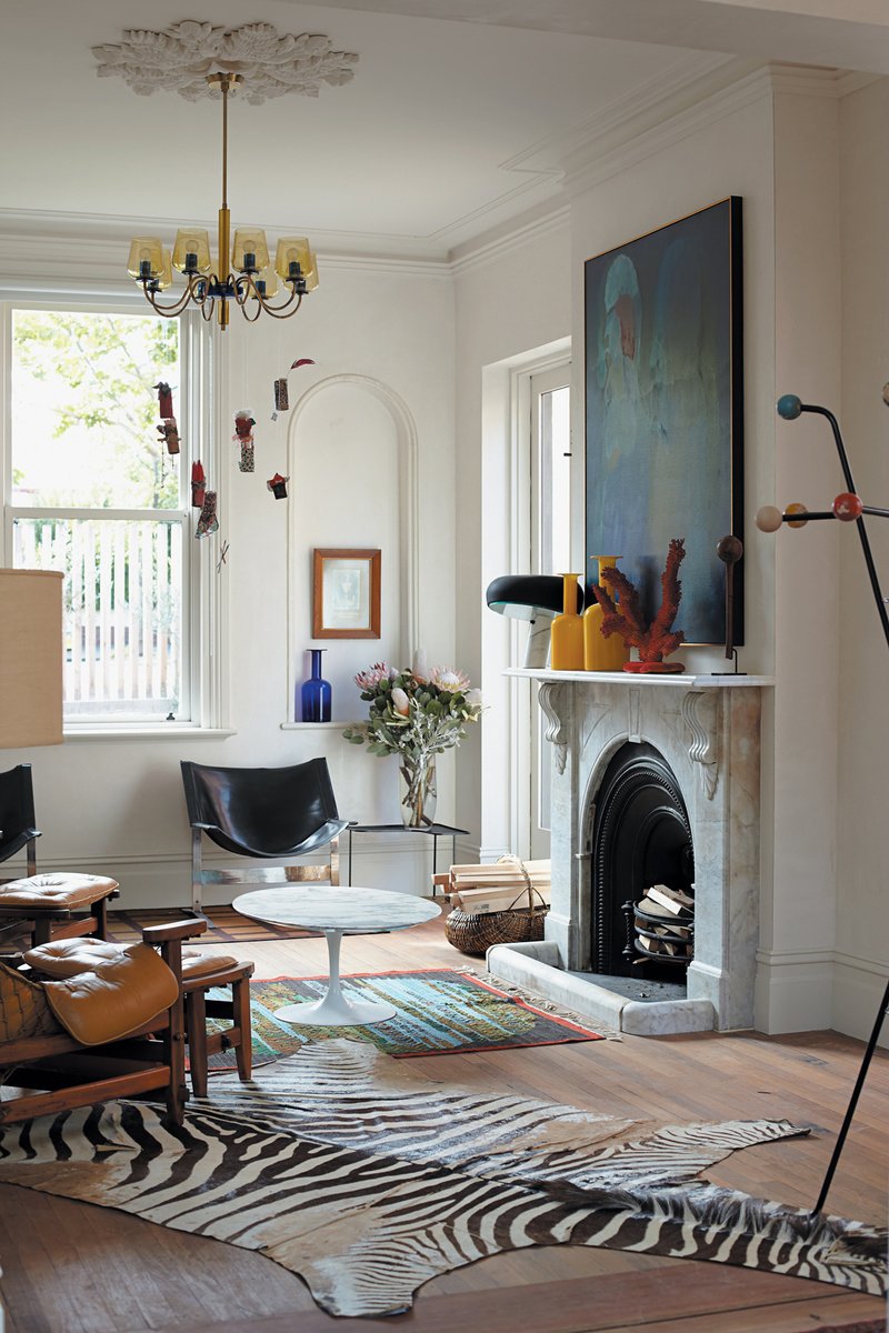 The formal lounge plays host to Angelucci’s collection of mid-century modern furniture. A pair of Leather Sling chairs by Aussie-born sculptor Clement Meadmore sit under the window; a black Snoopy lamp by Achille Castiglioni for Flos is on the mantle.