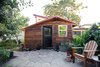 The studio’s redwood siding was milled from trees salvaged from a road-widening project in Sonoma County, California. The hardware, “two-hundred dollars’ worth of stainless-steel screws,” says Deeds, was purposefully left exposed as an architectural detail. Photo by Lenny Gonzalez Photo of Modern East Bay Getaways modern home