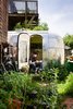 The Airstream is tucked into the back garden of a Berkeley co-op. "Having a garden at my footsteps and chickens just over the fence make it feel peaceful and private," says architect and resident, Andreas Stavropoulos. Photo by: Mark Compton Photo of Modern East Bay Getaways modern home