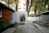 Modern home with Exterior, House, and Shipping Container Building Type. Two converted shipping containers (left) now house offices for Shoup’s design/build firm. “Perhaps the most successful aspect of turning this into a place to live and an office rather than just have this shop space was moving it towards real indoor-outdoor living,” he says. Taya Shoup, a landscape designer, has refined her husband’s vision for the property with a courtyard and plantings. Photo by building Lab inc. Photo of Modern East Bay Getaways