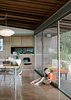 Modern home with Dining Room, Table, Chair, Pendant Lighting, and Concrete Floor. Luke channels Jimi on the concrete floor of the open living and dining room. Photo of Modern East Bay Getaways