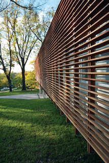 Contemporary Kansas Home with Wood Slatted Exterior Screen