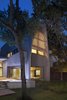 Modern home with Exterior, Mid-Century Building Type, and House Building Type. The architects felt that a strong vertical addition would draw extra attention to the original house’s strong horizontal character. The tower itself is a reinterpretation of an A-frame from another Strenger house five doors down. Photo of Renovated Midcentury Home in Austin Doubles Square Footage