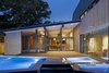 Modern home with Exterior and Mid-Century Building Type. A pool located just outside the dining space and master bedroom echoes the home's angular forms. Photo of Renovated Midcentury Home in Austin Doubles Square Footage