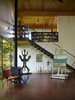 Hoover's favorite aspect of the house is its calm mood and "the quietude and solace I experience while inside," she says. "I am also very content with the decision to heat from a wood stove, it makes the modern structure feel that much homier." Photo of An Eco-Friendly Compact Cabin in Washington modern home