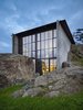 Modern home with Exterior and House. The Pierre by Olson Kundig Architects: An elegant, brutalist building is integrated into the surrounding rocky landscape. Photo by Benjamin Benschneider. Photo of Olson Kundig Houses