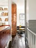 Modern home with Office, Chair, and Shelves. The copper-covered volume extends from the first floor, where it contains coat and shoe storage. Photo of Fall Design Trend: Gold, Brass, and Copper Accents