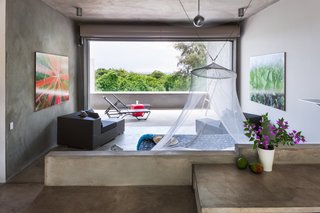 Like the other buildings onsite, John Hix designed Casa Solaris to take advantage of the natural forces here in Vieques; wind, sun and rain. By creating open spaces, where basically the fourth wall is missing, John created a space that takes advantage of the trade winds that flow through the Vieques hills. By placing the open wall towards the trade winds (to the East), the room is constantly cooled, leaving no need for air conditioning. 