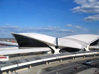 Dubbed the "Grand Central of the Jet Age" by critic Robert A.M. Stern, Eero Saarinen’s curvaceous TWA Flight Center was a paean to the romance of flight. The sloped concrete roof recalls two flapping wings, while contours constantly bend and flow into each, creating a fluid collection of terminals, staircases and forms. After being shuttered for years, the space has been turned into a luxury hotel.