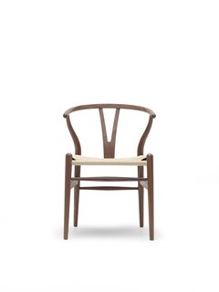The Wishbone Chair (1949), also known as the Y Chair, marries a hand-woven seat and steam-bent frame. The chair, an undisputed modern icon, has been in continuous production since its introduction in 1950. Inspired by portraits of Danish merchants sitting in Ming chairs, this was the culmination of a series of chairs created in the ‘40s. Photo courtesy Carl Hansen & Son.
