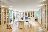 The light-filled pavilion centers around the residents' joint workstations. Photo 4 of Eastside Addition modern home