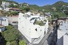 Located on a sharply sloped site in Pyeongchang-dong, a suburb of Seoul, South Korea, this home designed by Hyo Man Kim of Iroje KHM Architecture unfolds like an origami flower. Inside, secluded outdoor spaces lend sunlit interiors and privacy to the two-family dwelling housed within its faceted, asymmetrical exterior. Photo of These Contemporary Homes Defy Convention modern home