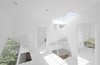 A series of square cut-outs at varying angles creates similar-yet-unexpected geometric voids that connect each of the rooms in this vacation home on Japan's Boso Peninsula. Designed by Yuusuke Karasawa, the home's complex interior belies its orderly cube exterior facade. Photo of These Contemporary Homes Defy Convention modern home