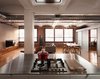 Modern home with Kitchen and Cooktops. The building was built in 1910. "It’s a pretty raw space with rough exposed brick, barrel vaulted ceilings, original hardwoods, and exposed ducting," Greenawalt says. "We tried to use industrial materials—stainless steel, perforated steel, brick—in a more refined way for the kitchen." Photo of Clever Red Pegboard Backsplash in a Remodeled Kitchen