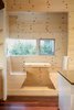 The knotty-pine breakfast nook, which is similar to what was a signature feature of 1920s and ’30s Spanish-style houses—though the originals were decorated in a Moorish theme. Photo 4 of Courtyard House modern home