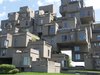 Habitat 67 -- Montreal, Canada (1967)
Israeli-Canadian architect Moshe Safdie’s thesis project at MCGill University ended up being one of the world’s most recognizable Brutalist buildings, an array of stacked, block-like forms on the St. Lawrence that integrate the airiness of suburban dwellings with the realities of dense urban living. By stacking prefabricated concrete “boxes,” Safdie demonstrated a new way to create apartments. Photo courtesy Graham and Sheila, Creative Commons. Photo of Art Brut: Revisiting Brutalist Architecture modern home