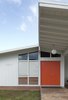 Modern home with Exterior and Mid-Century Building Type. Fritz explains, “The primary inspiration was Dutch International Style design. The clients have roots in Holland and it started out looking more De Stijl than it does now, but ultimately, they wanted something that drew as much from their present in Hawaii as their past in Europe.” Photo 3 of Hillside House No. 3