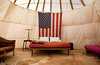 Modern home with Bedroom, Lamps, Night Stands, Rug Floor, and Bed. This interior shot of one of El Cosmico's teepees pairs life on the road with the American dream. Photo 4 of El Cosmico