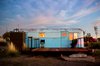 Modern home with Exterior, Metal Siding Material, and Camper Building Type. A sky-blue vintage trailer blends in with the sky. Photo 5 of El Cosmico