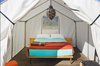 Modern home with Exterior and Tent Building Type. Brightly colored sheets and a central pendant lamp show this tent to its best advantage. Photo 7 of El Cosmico