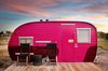 Modern home with Exterior, Metal Siding Material, and Camper Building Type. An innovative splash of color carries this trailer into compatibility with the pink clouds striating the horizon. Photo 6 of El Cosmico