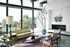 Modern home with Living Room, Concrete Floor, Sofa, Chair, Coffee Tables, Rug Floor, Table Lighting, End Tables, and Standard Layout Fireplace. A Nelson sofa sits on a handmade Persian Mahi rug in the living room. Photo of Design Guide: San Diego