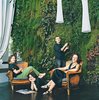 Modern home with Living Room and Chair. The Dimanches relax in their exotic living room. Photo of Best Modern Hotspots in Paris