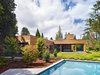 Modern home with Outdoor, Swimming Pools, Tubs, Shower, Trees, Shrubs, and Grass. Through an integral relationship between use, form, and material, the Low/Rise House responds sensitively to site, nature, and neighborhood, creating a new type of suburban living – both urban and rural. Photo of Low/Rise House
