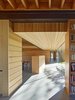 Modern home with Hallway and Slate Floor. Maximizing daylight is only one of the sustainable design strategies used in the Low/Rise residence. Photo 4 of Low/Rise House