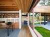 Modern home with Office, Chair, Slate Floor, Bookcase, Study, and Desk. The relationship between interior and exterior becomes crucial in the articulation of the residence. Photo 5 of Low/Rise House