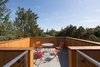 Modern home with Outdoor and Rooftop. Atop the 30-foot tower, a roof deck emerges through the trees, providing a unique vantage point of the structure below and the surrounding townscape. Photo 9 of Low/Rise House